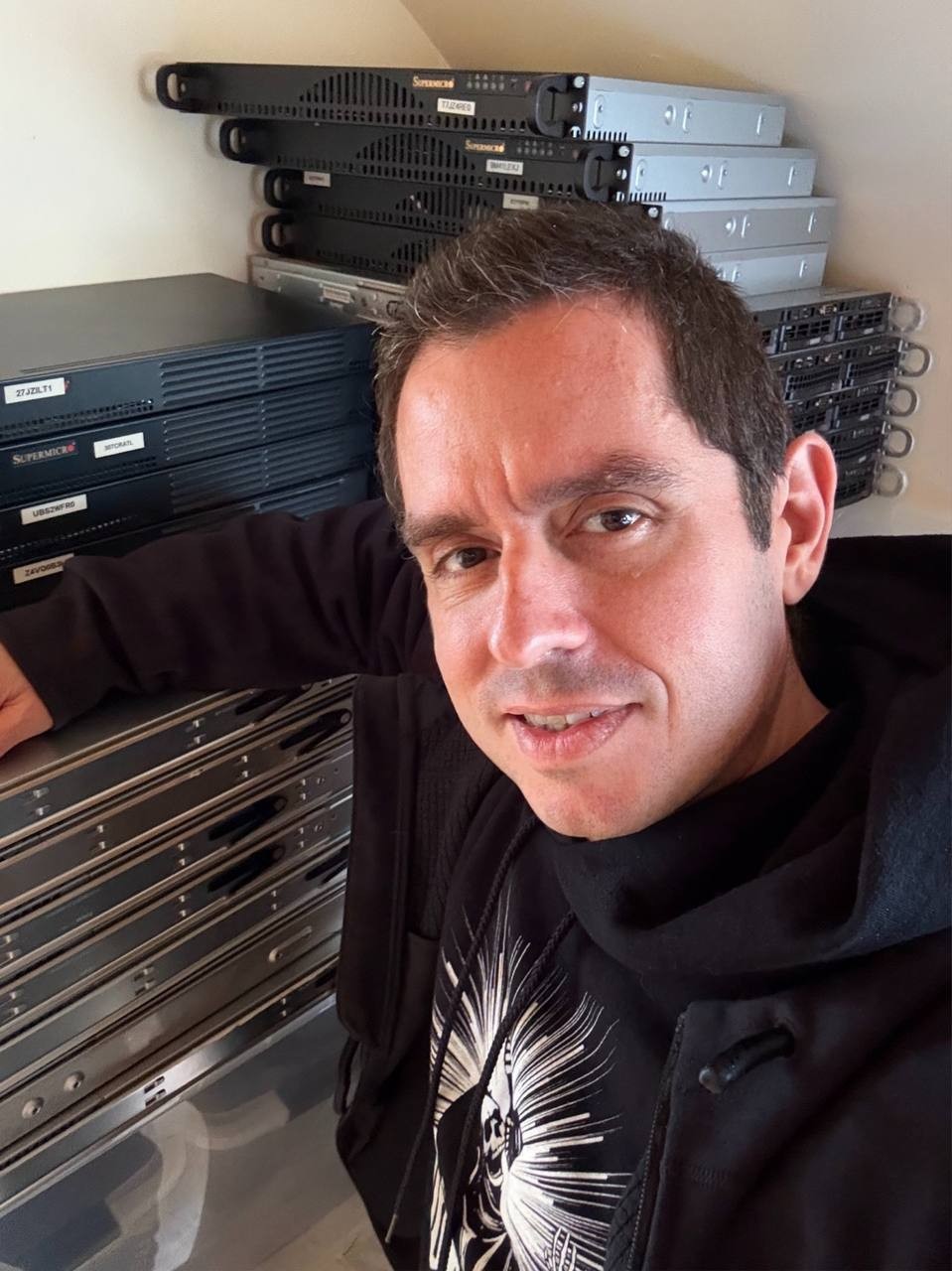 Christophe Casalegno in front of computer hardware