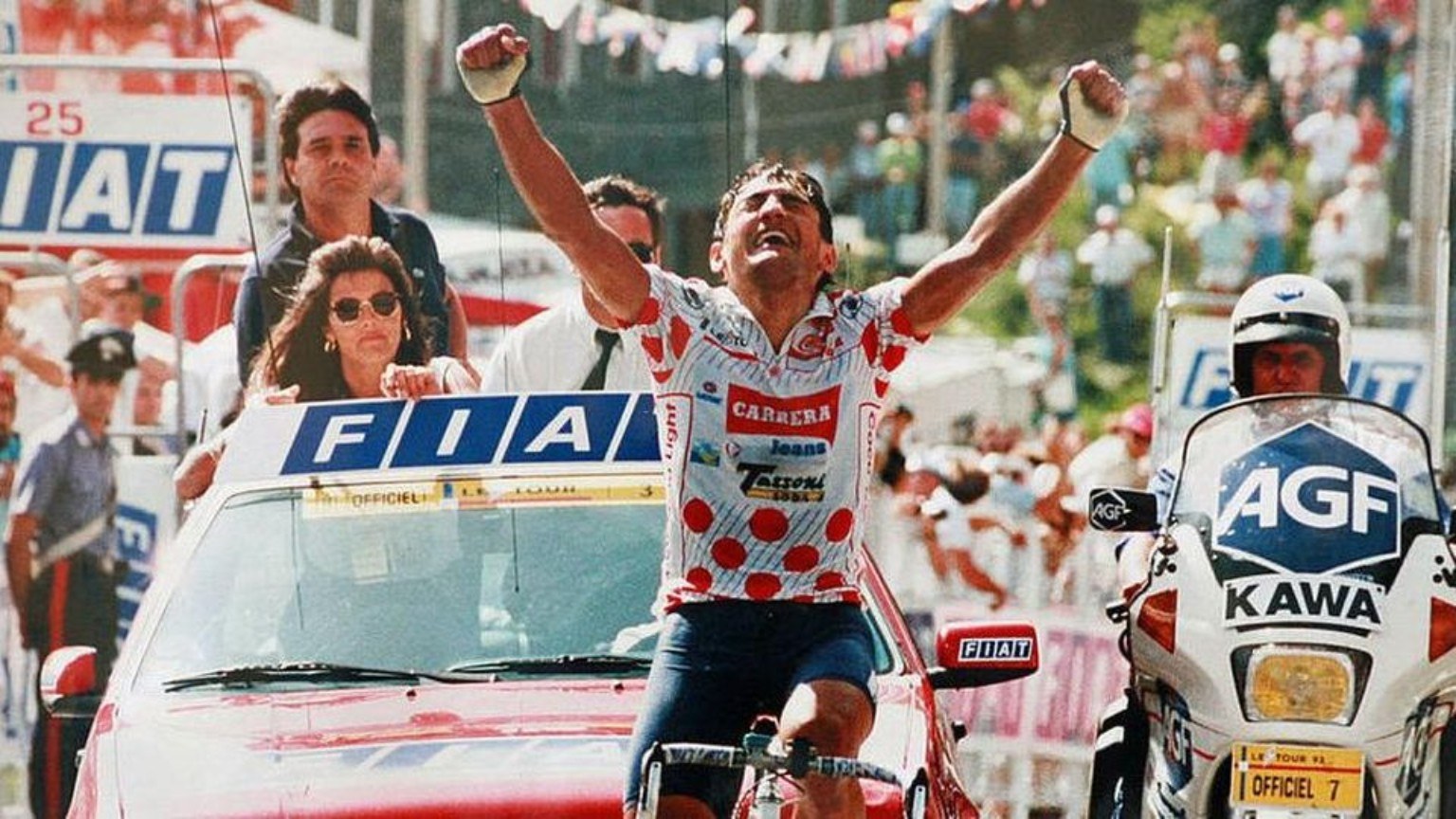Claudio Chiappucci, arms raised in the polka-dot jersey, winning the Sestriere stage of the Tour de France on 18 July 1992
