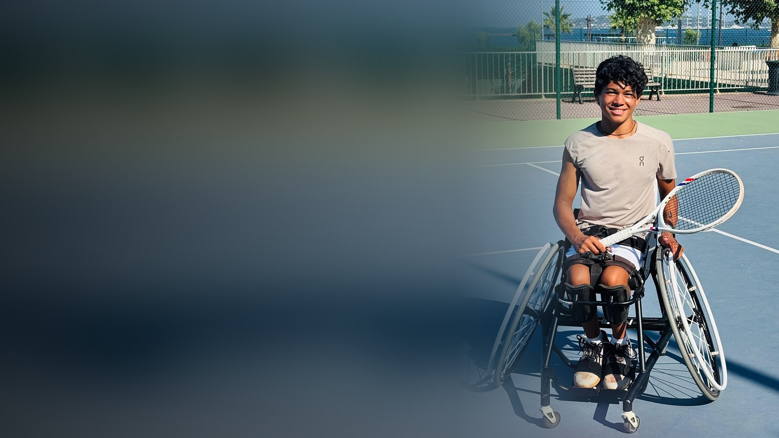 Melvil Vedrenne-Cloquet in his wheelchair on a tennis court, racket in hand